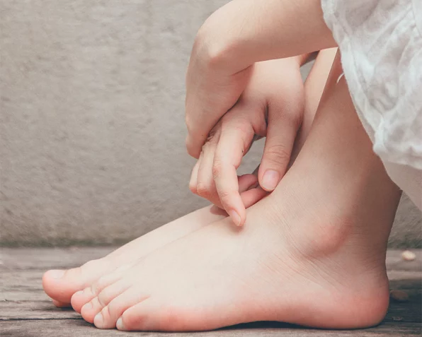 Close-up of a woman's feet resting peacefully, representing relaxation and reflexology services at The Rest Nest in Tonbridge, Kent.